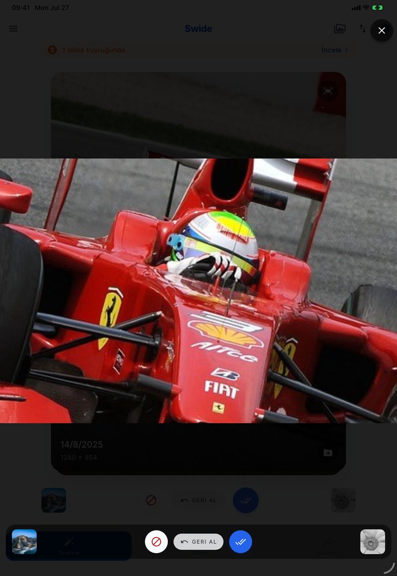 Pinch-to-zoom in Swide on iPad, filling the screen with a zoomed-in race car photo