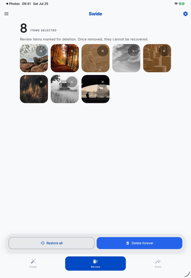 Swide review screen on iPad showing eight photos selected for deletion with Restore all and Delete forever buttons