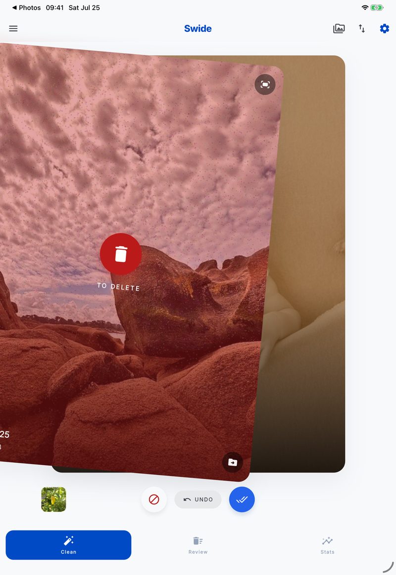 Swide on iPad: a photo card swiped left and marked to delete, with undo and keep buttons below the stack